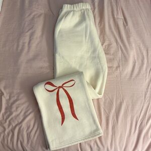 Cream Sweatpants with Red Bow Design